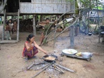 preparing and selling fried bananas for breakfast