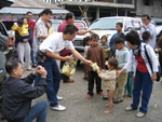 giving out sweets to the poor neighbour country