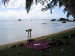 cleaning dishes on the beach after lunch