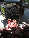 pig's head (part of) and tuk-tuk